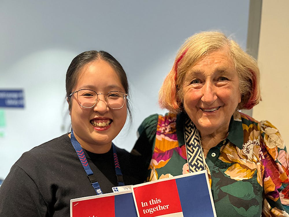 Two women hold the new RMH Community Engagement Strategy