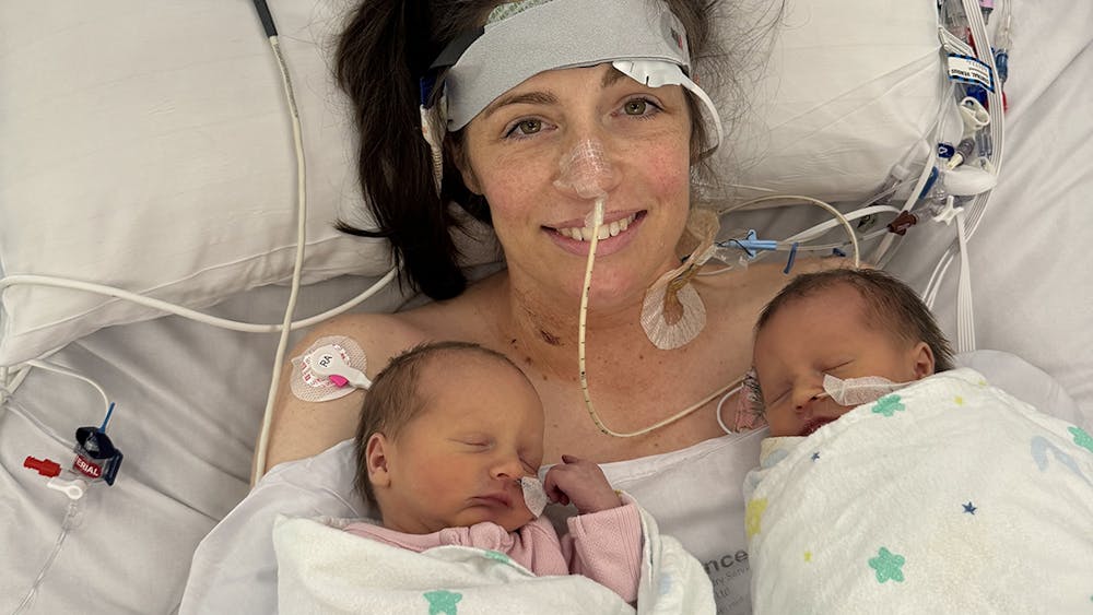 Alex Judd with twins