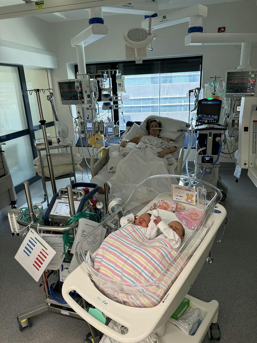 Alex on ECMO with twins in bassinet