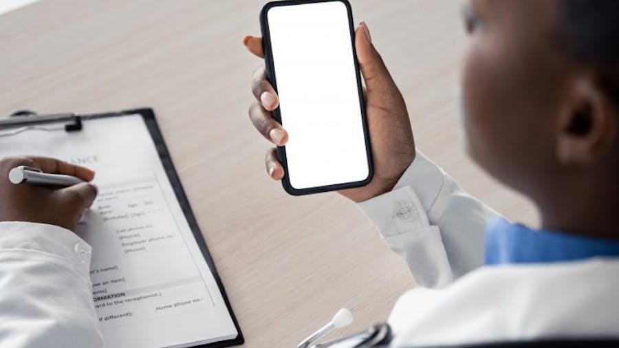Doctor with phone and checklist