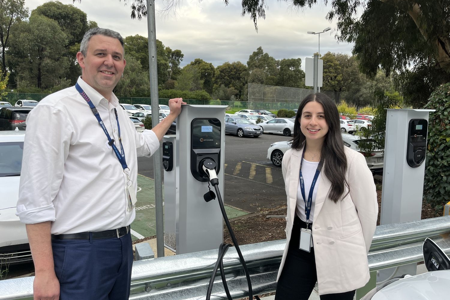 Nathanael Sneddon and Meagan Rhodes with EV stations