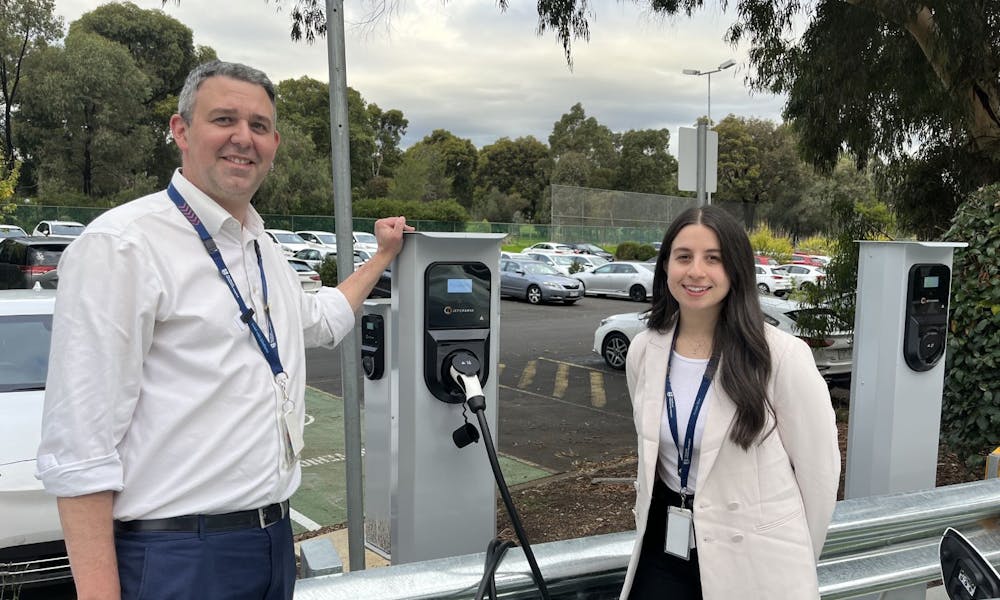Nathanael Sneddon and Meagan Rhodes with EV stations