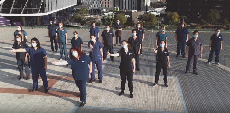 Scrub Choir perform on helipad