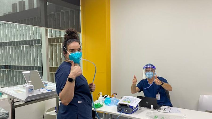 Staff give thumbs up during mask fit testing