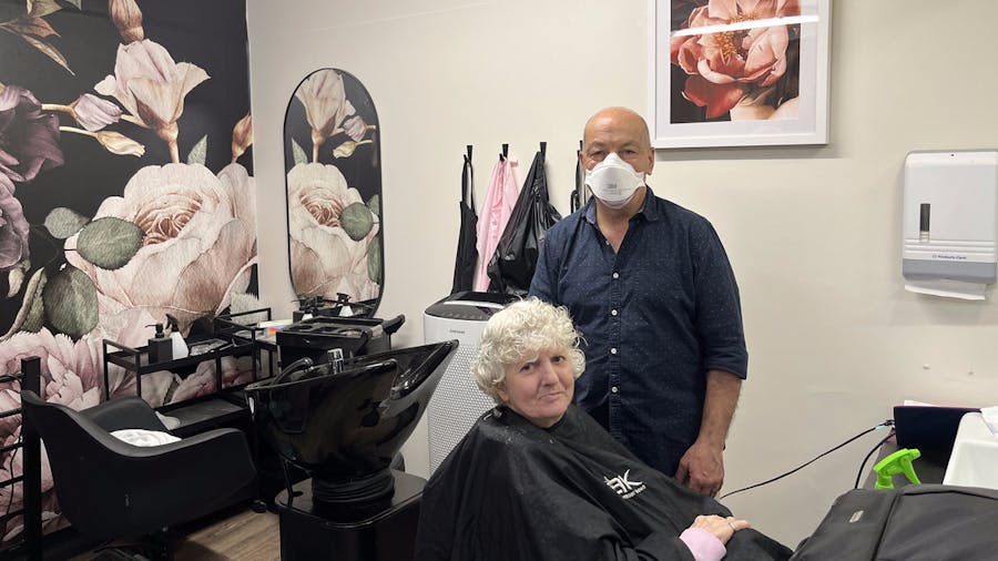 Tony and client in Boyne Russell hair salon