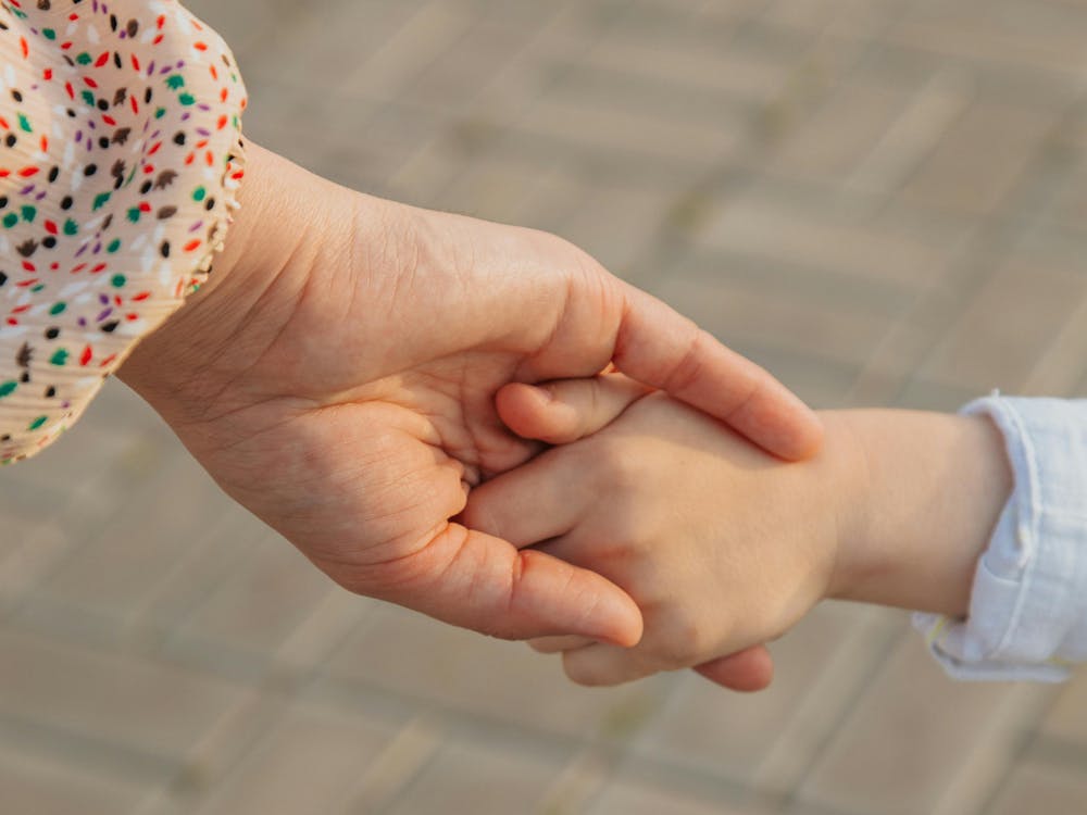 childs-hand-holding-hand-of-adult.jpg