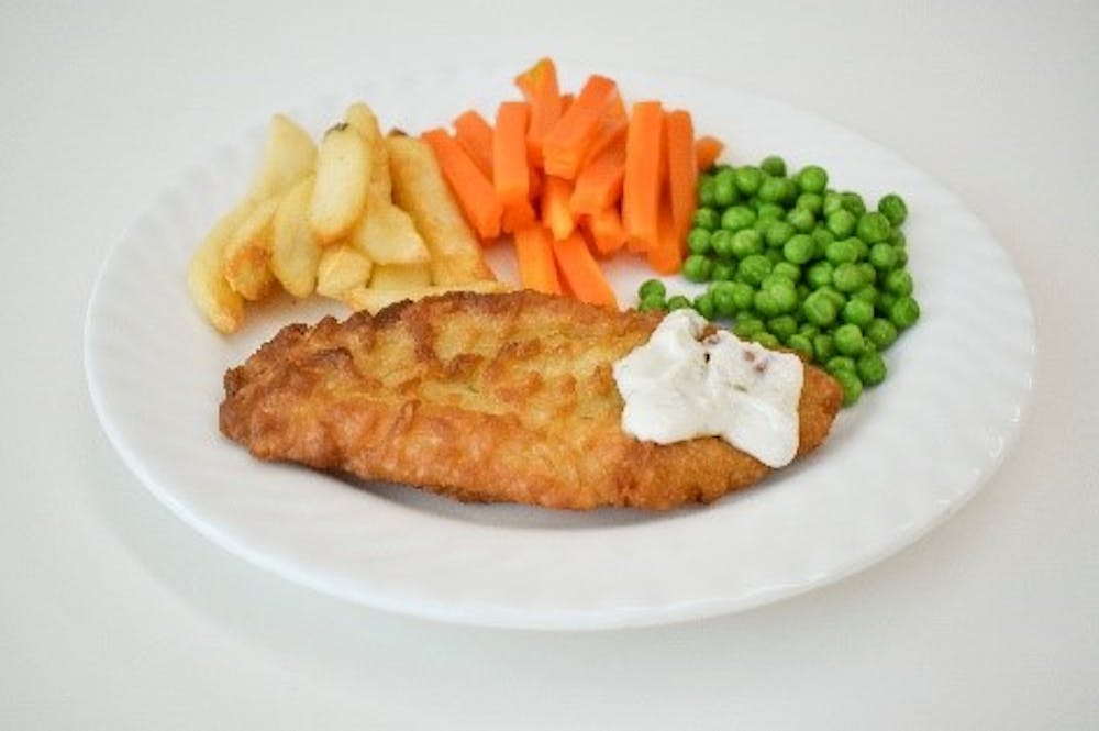 Example of patient meal of battered fish, chips and vegetables