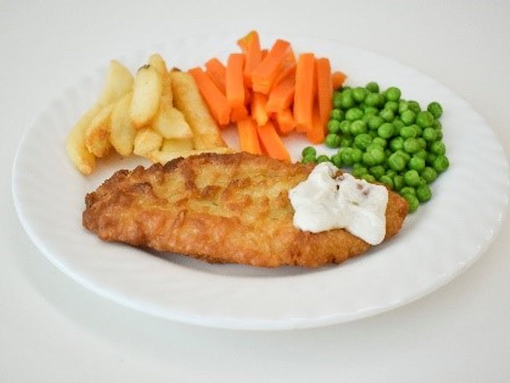 Example of patient meal of battered fish, chips and vegetables