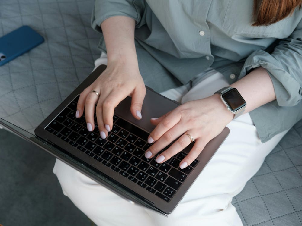 Woman typing on laptop