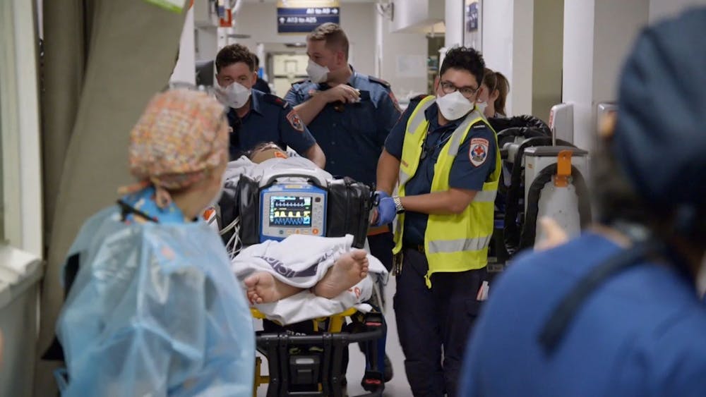 paramedics-wheeling-patient-into-emergency-on-stretcher.jpg