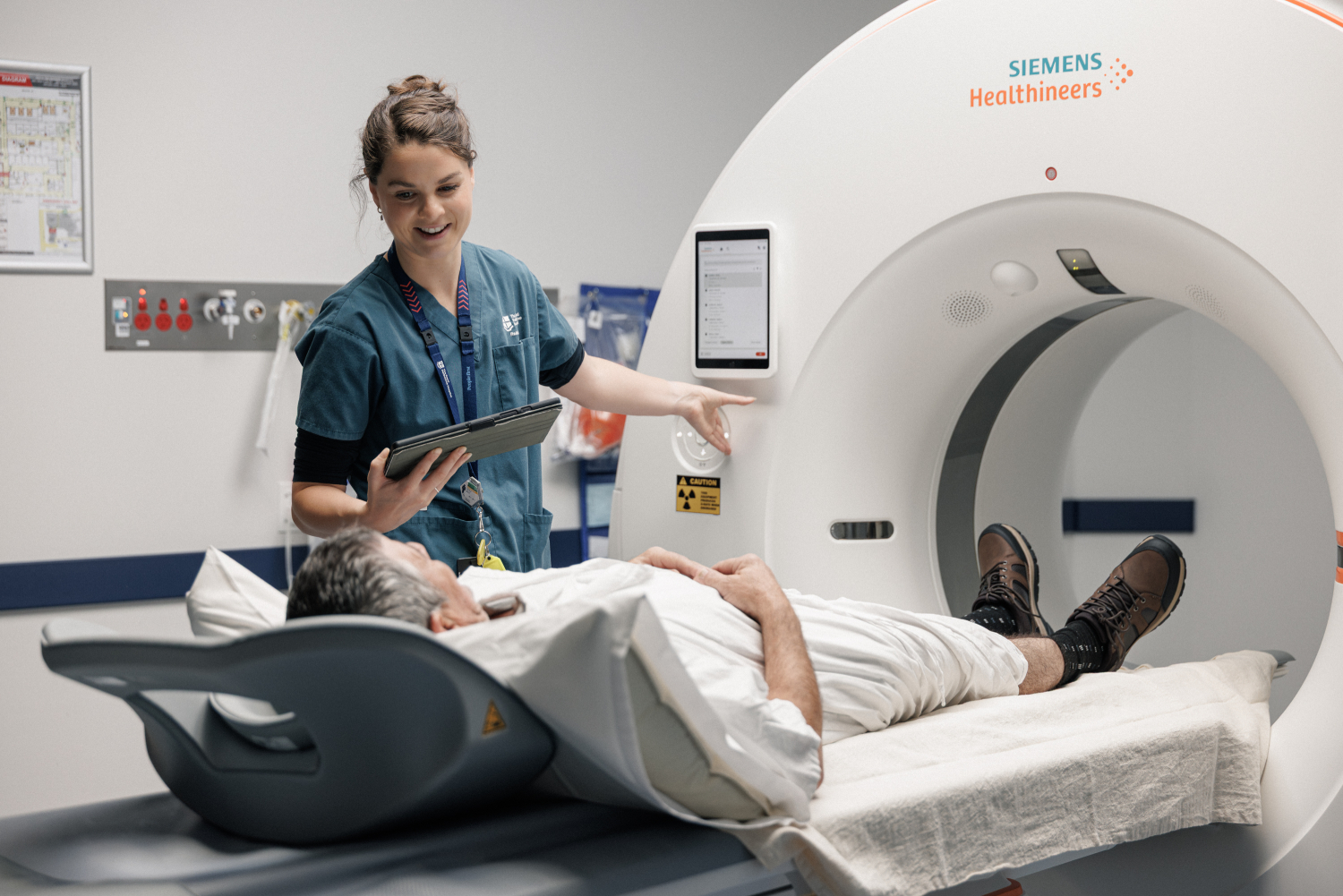 radiology-staff-member-provides-imaging-scan-to-patient.jpg