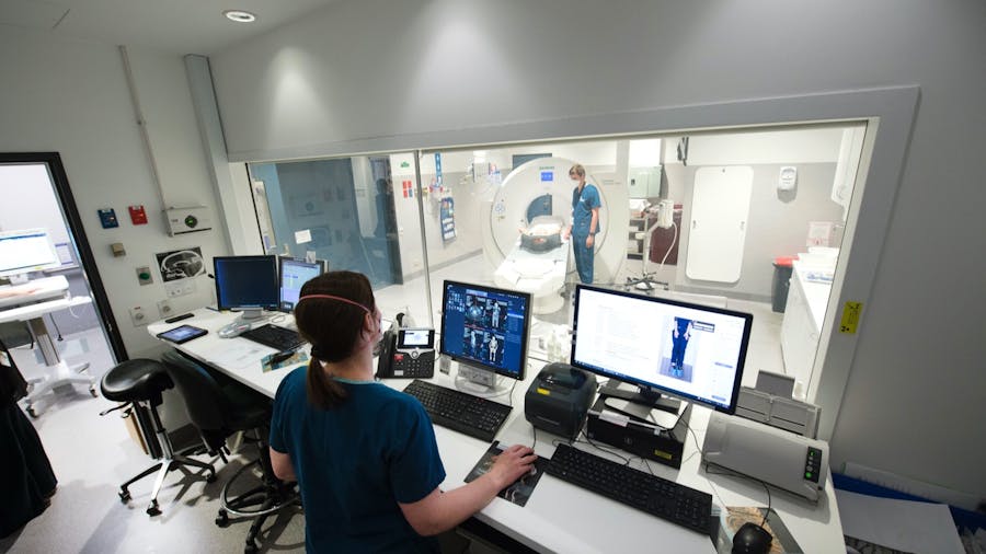 Technicians scanning a patient in Medical Imaging
