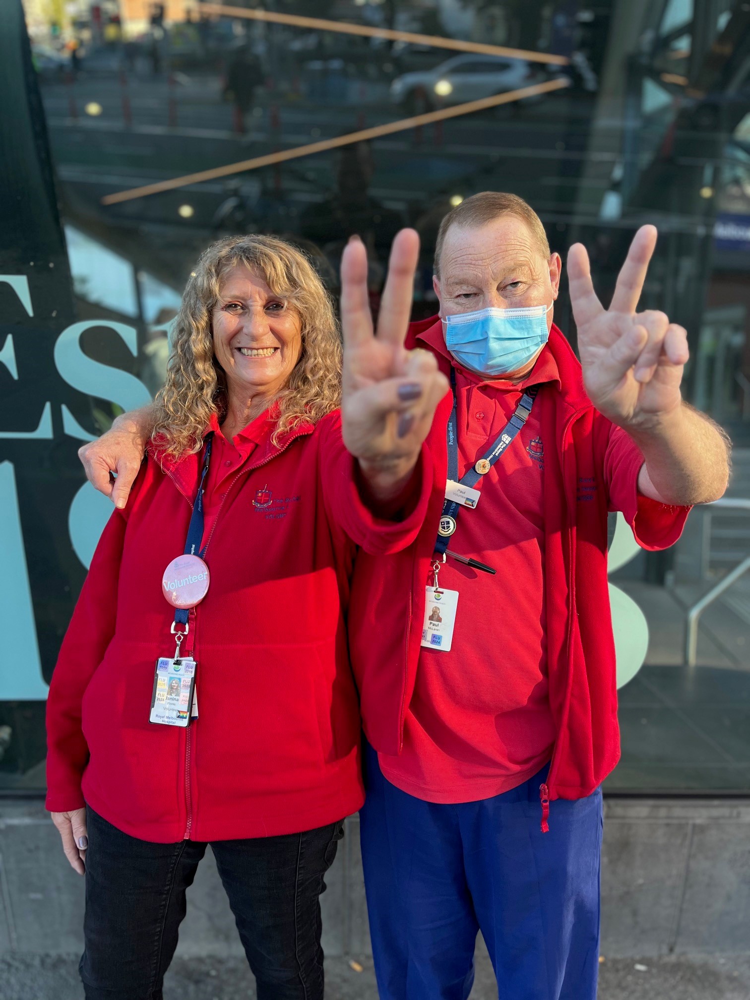 two-rmh-volunteers-giving-peace-sign.jpg