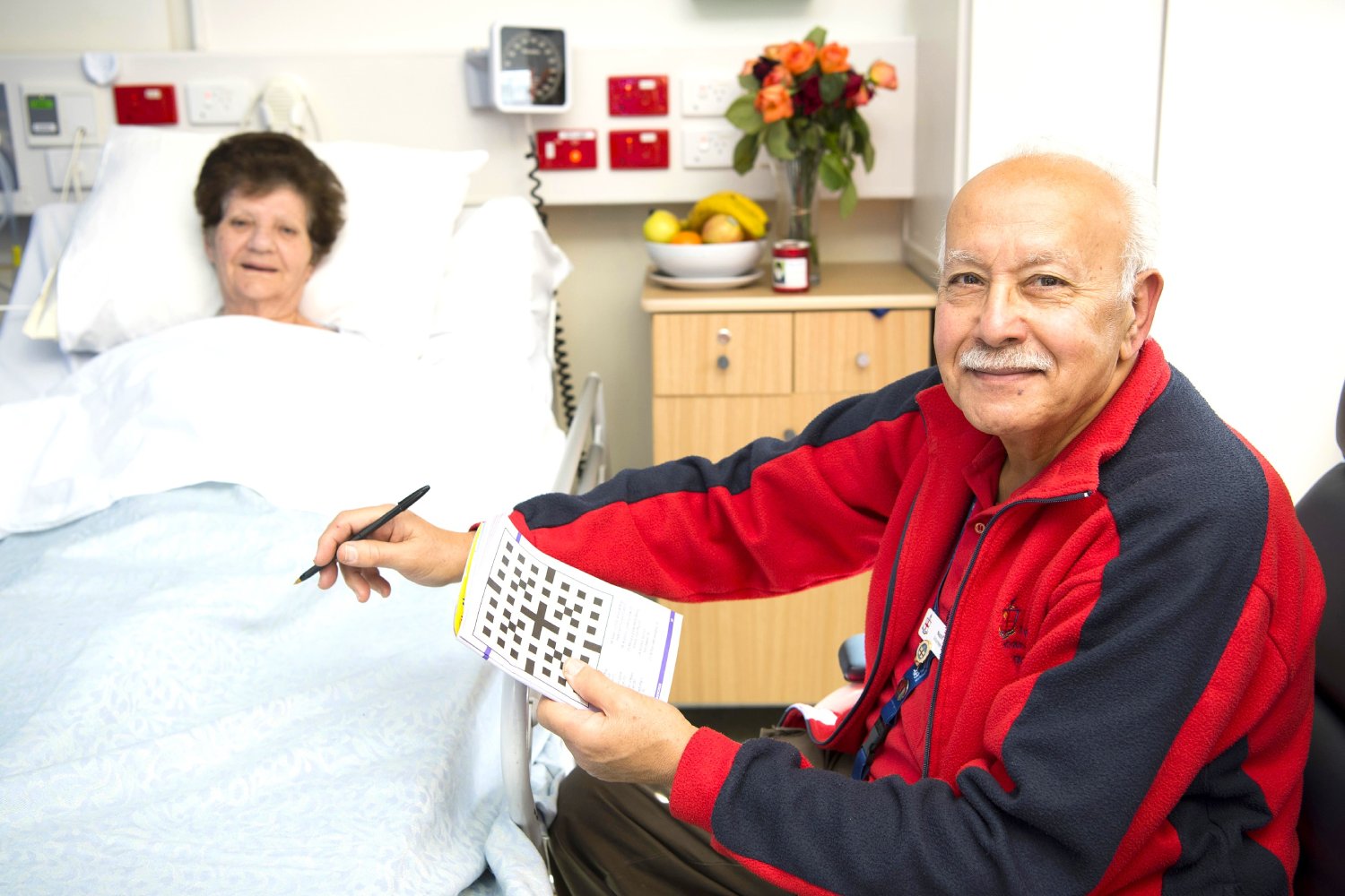 volunteer-doing-crossword-with-patient.jpg