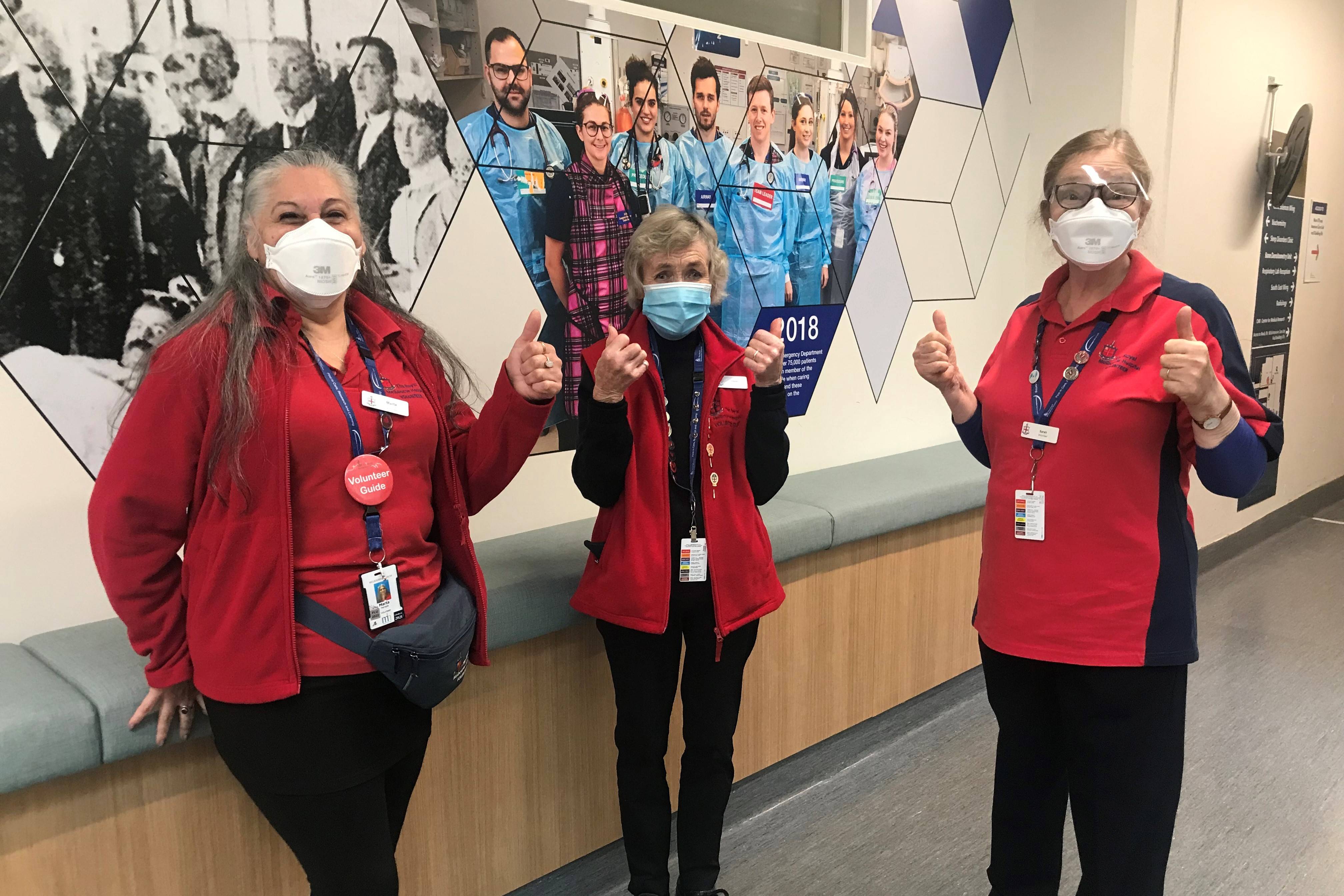 volunteers-wearing-masks-and-giving-thumbs-up.jpg