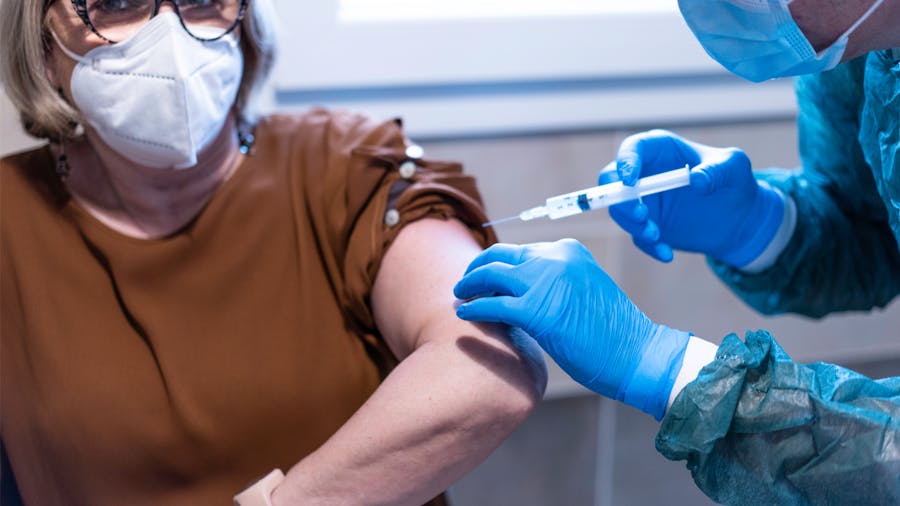 Woman receiving vaccination